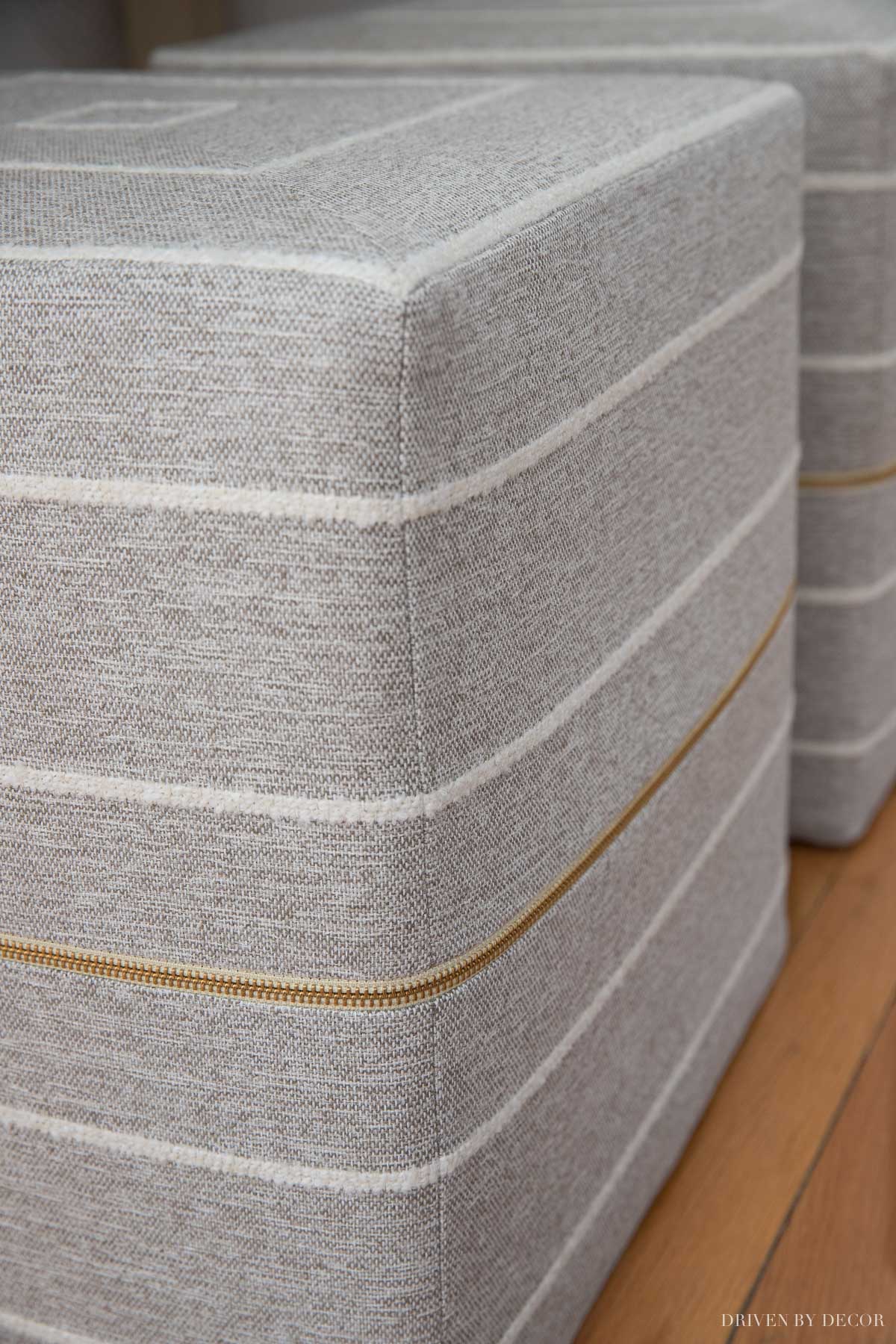 gray-cube-ottomans-brass-zippers Love the gorgeous brass zippers on these cube ottomans!