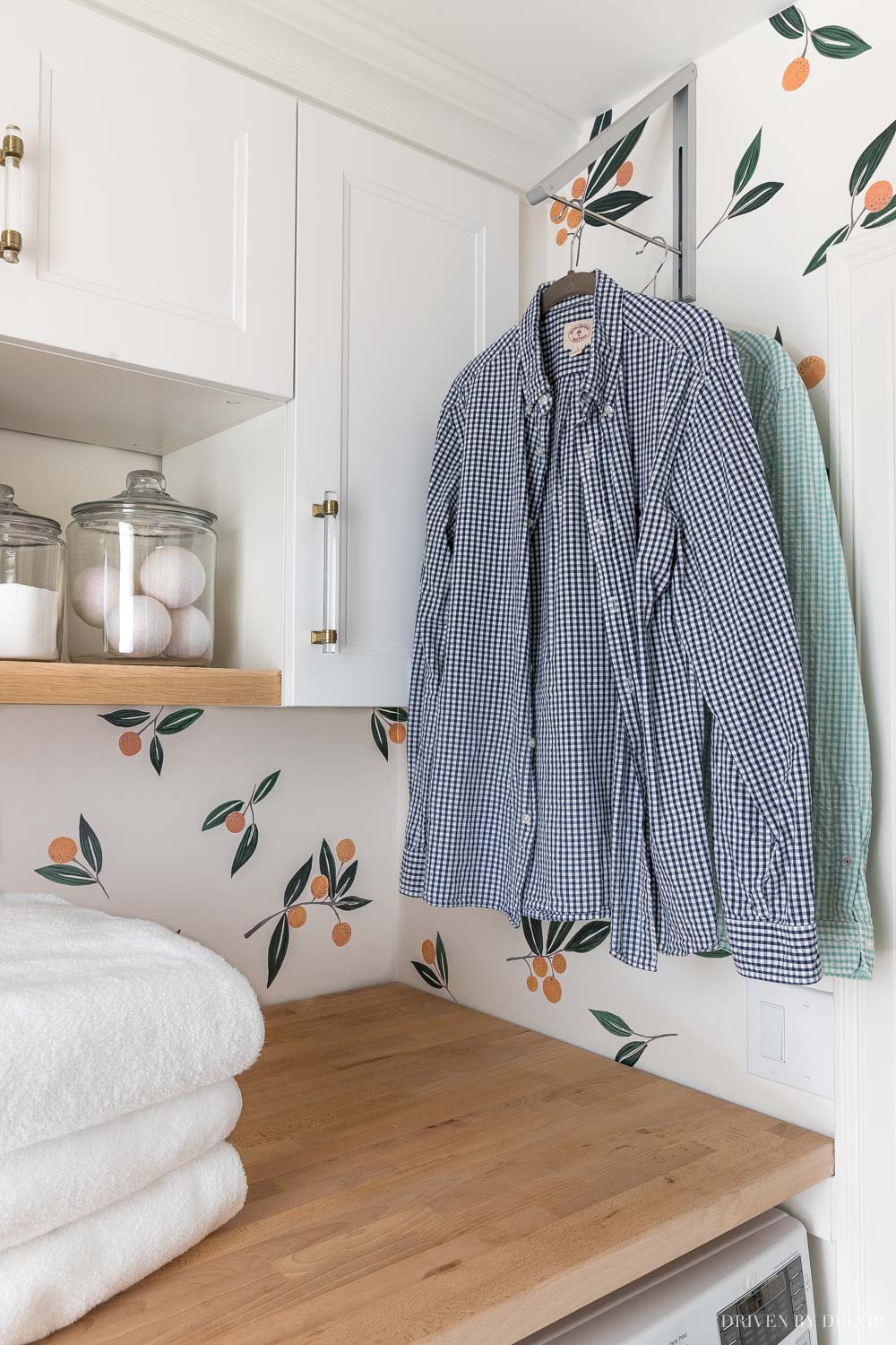 laundry-room-clothes-rack Love this retractable clothes rack for hanging clothes to dry in our laundry room!